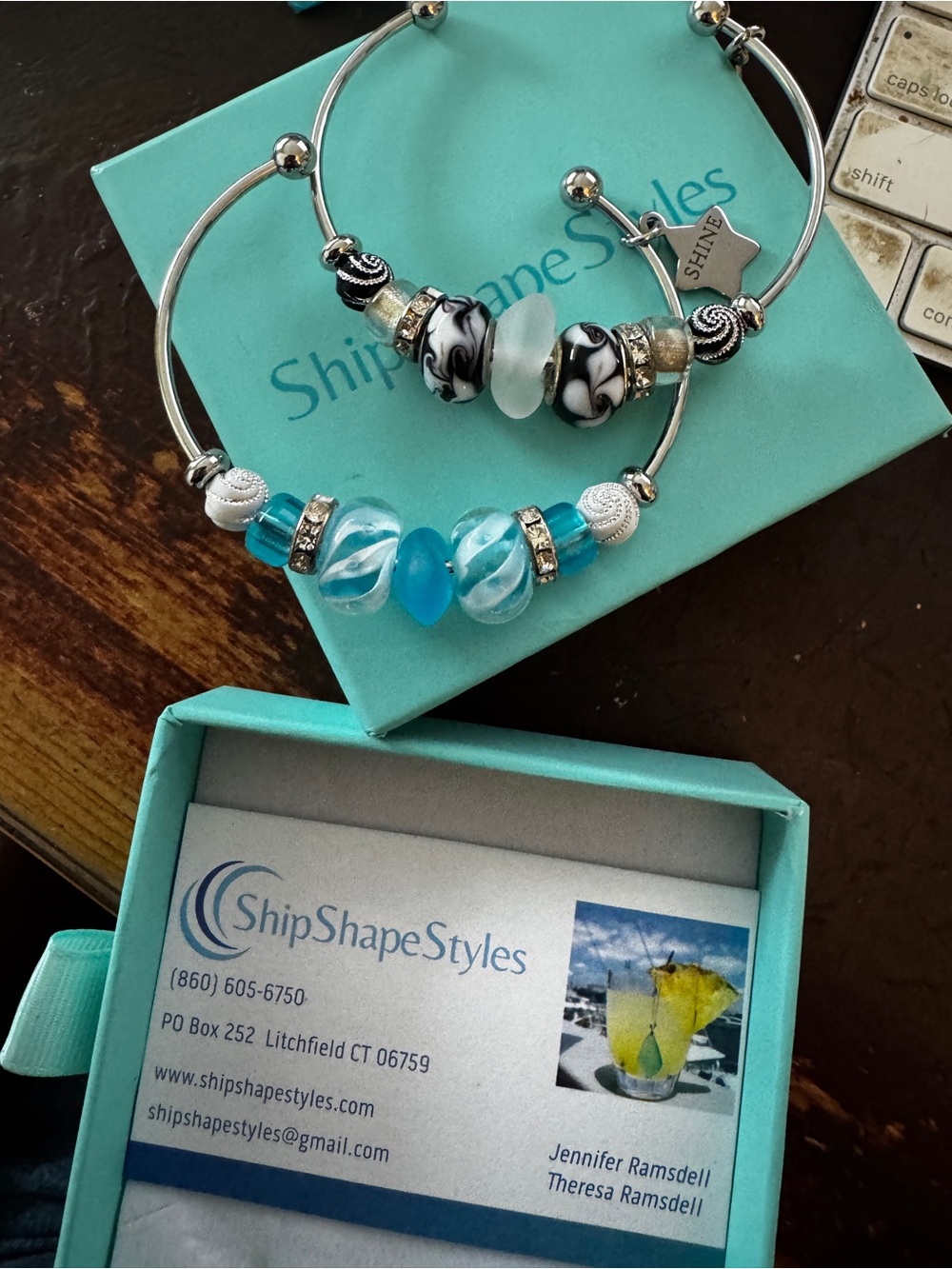 Two stainless steel and art glass bangles